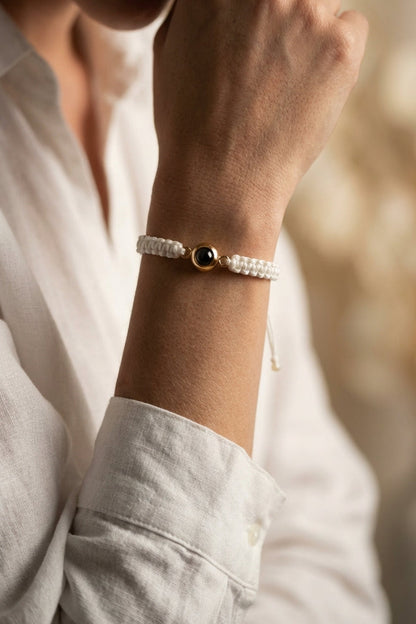 Close-up of a wrist wearing a bracelet with a blurred background